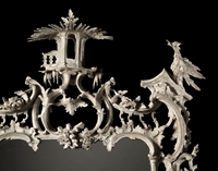 A RARE CHIPPENDALE PERIOD CARVED AND PAINTED MIRROR  Retaining its original white painted decoration