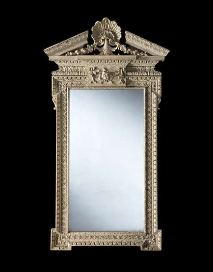 A GEORGE I PERIOD CARVED MIRROR retaining its original paint
