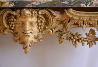A GEORGE II GILTWOOD CONSOLE TABLE