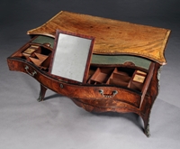 A George III period mahogany serpentine commode Attributed to Henry Hill of Marlborough
