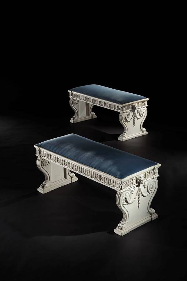 An important pair of carved and white painted hall benches from Kenwood House
