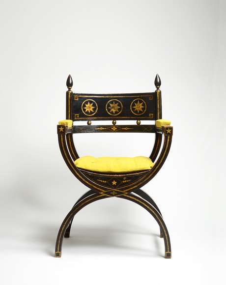 An Impressive Ebonised and Gilt Decorated Regency Period X-Framed Armchair