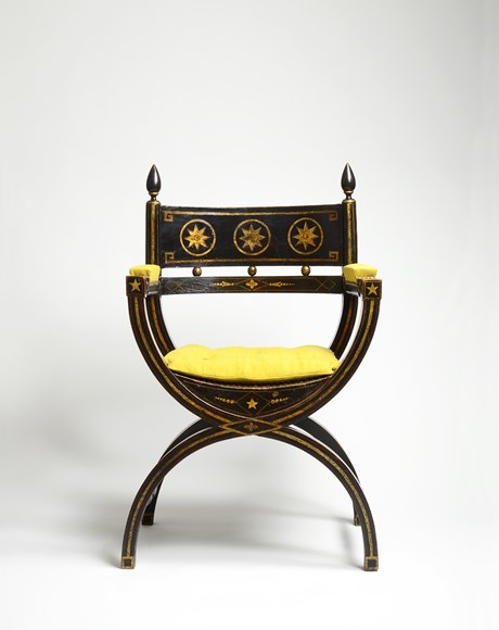 An Ebonised and Gilt Decorated Regency Period X-Framed Armchair