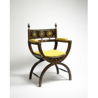 An Ebonised and Gilt Decorated Regency Period X-Framed Armchair