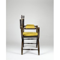 An Ebonised and Gilt Decorated Regency Period X-Framed Armchair