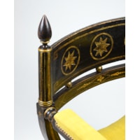 An Ebonised and Gilt Decorated Regency Period X-Framed Armchair