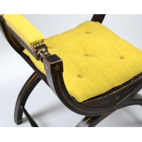 An Ebonised and Gilt Decorated Regency Period X-Framed Armchair