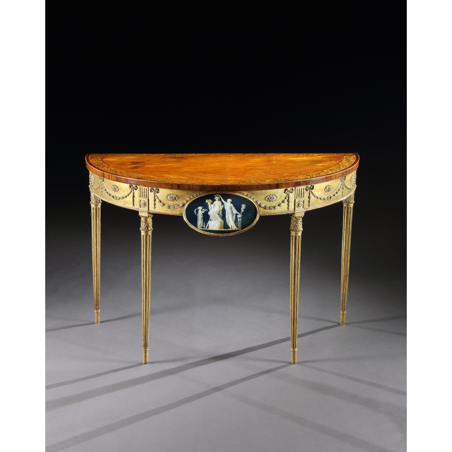 A George III Satinwood Marquetry Giltwood and Composition Demi-Lune Side Table