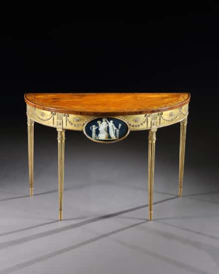 A George III Satinwood Marquetry Giltwood and Composition Demi-Lune Side Table