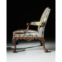 An important pair of George II period carved walnut Gainsborough armchairs