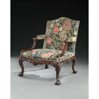 An important pair of George II period carved walnut Gainsborough armchairs