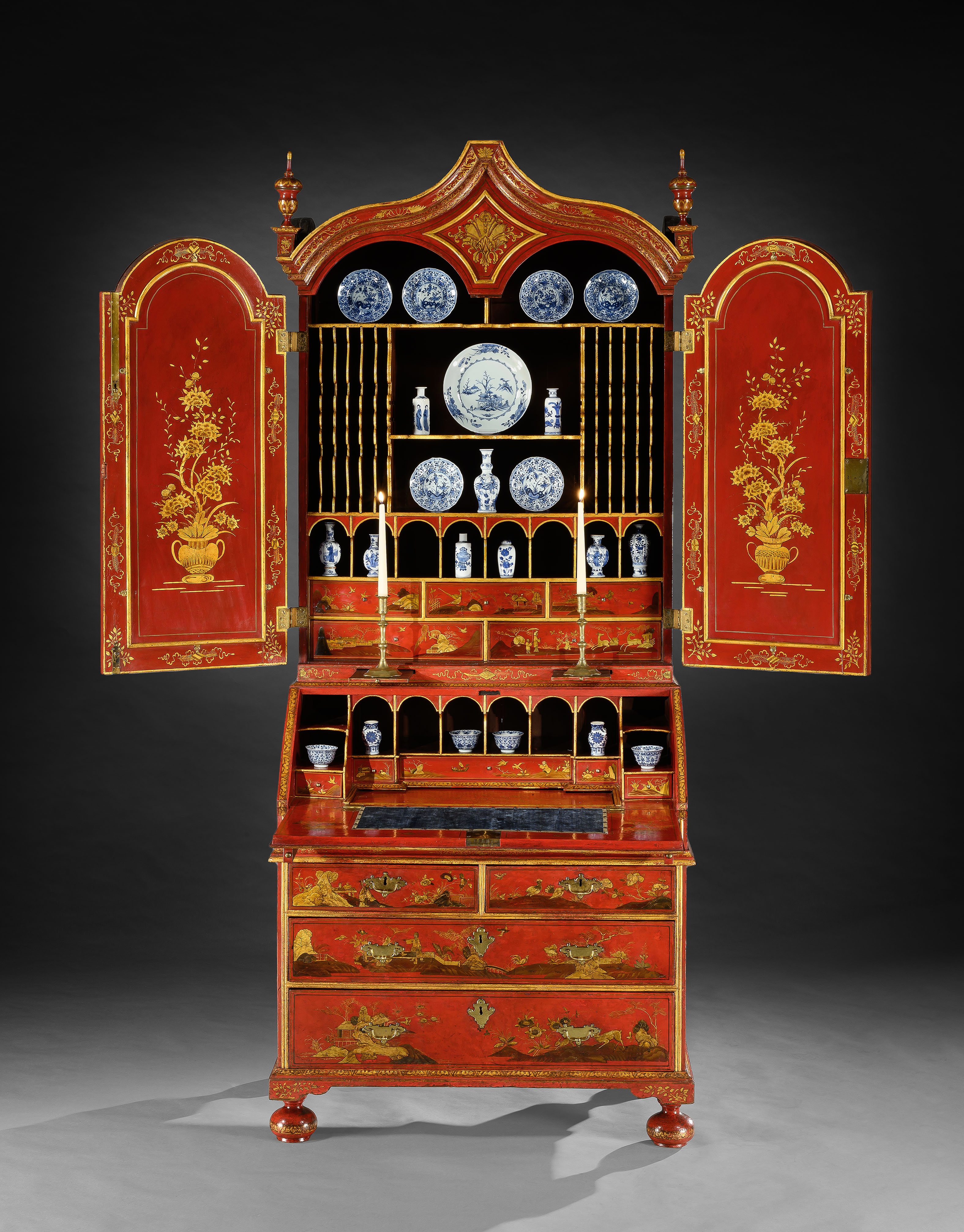 A GEORGE I PERIOD SCARLET AND GILT JAPANNED BUREAU CABINET