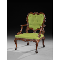 A RARE PAIR OF GEORGE II PERIOD CARVED MAHOGANY ARMCHAIRS AFTER A DESIGN BY THOMAS CHIPPENDALE