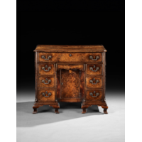 A George II Fiddleback Walnut Kneehole Desk