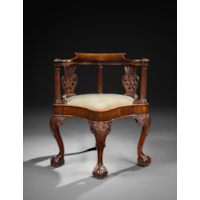 A GEORGE II CARVED MAHOGANY DESK CHAIR
