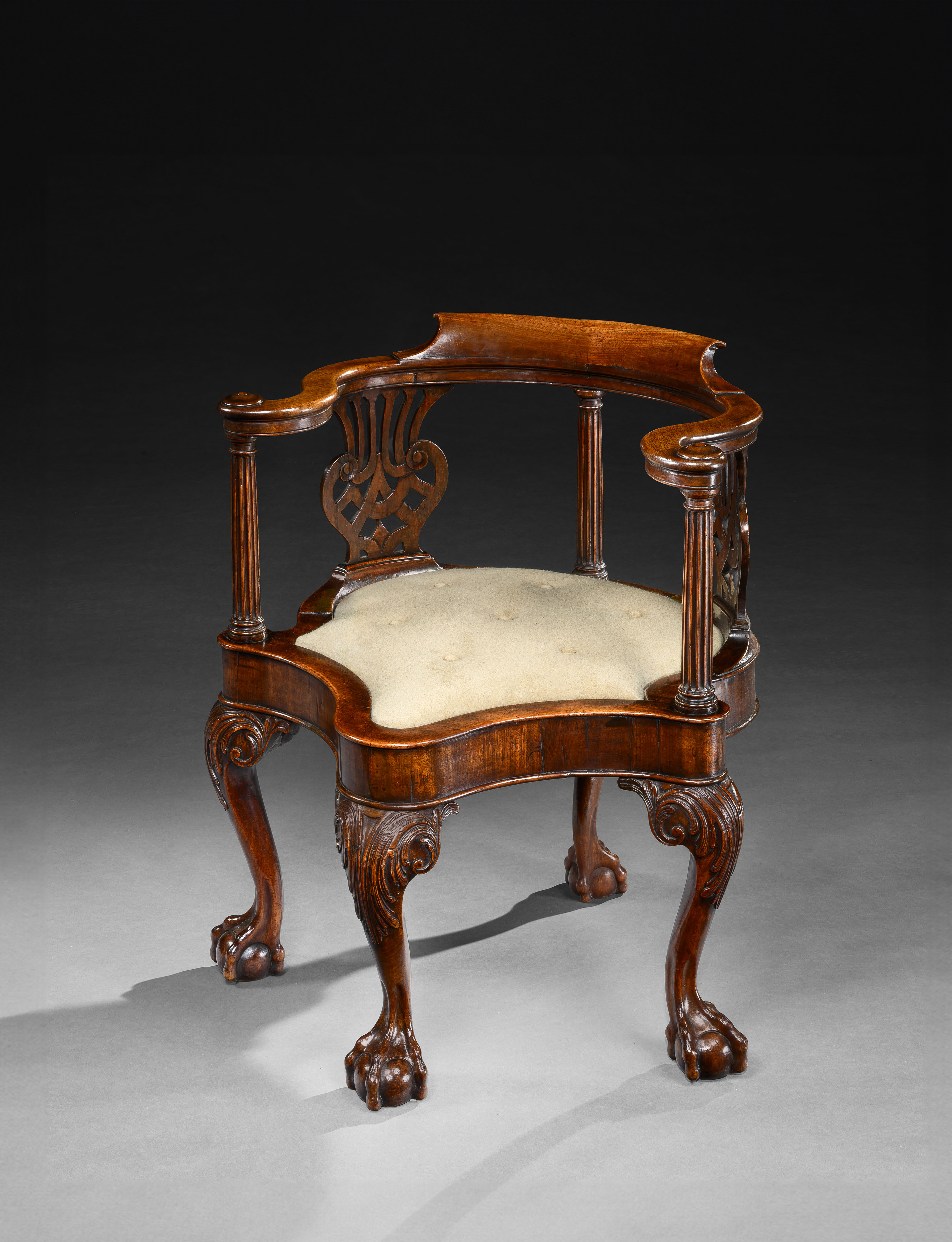 A GEORGE II CARVED MAHOGANY DESK CHAIR
