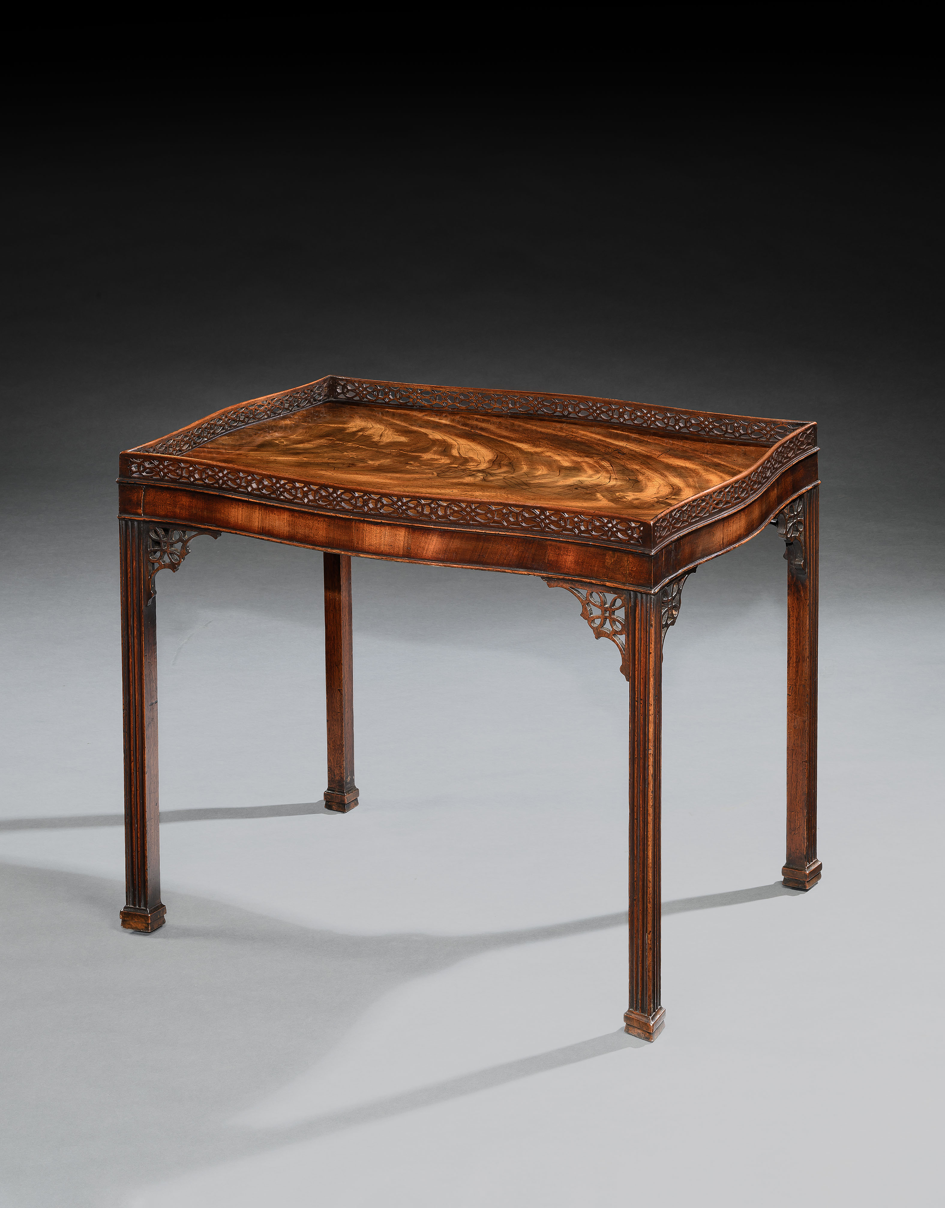 A GEORGE III CHIPPENDALE PERIOD MAHOGANY SILVER TABLE