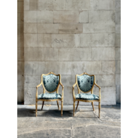 A PAIR OF GEORGE III PERIOD GILTWOOD ARMCHAIRS