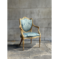 A PAIR OF GEORGE III PERIOD GILTWOOD ARMCHAIRS