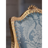 A PAIR OF GEORGE III PERIOD GILTWOOD ARMCHAIRS