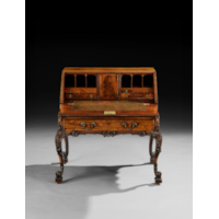 AN EXCEPTIONAL GEORGE III PERIOD CARVED MAHOGANY BUREAU ON STAND