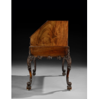 AN EXCEPTIONAL GEORGE III PERIOD CARVED MAHOGANY BUREAU ON STAND