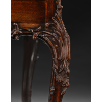AN EXCEPTIONAL GEORGE III PERIOD CARVED MAHOGANY BUREAU ON STAND