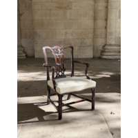 A GEORGE II CARVED MAHOGANY ARMCHAIR