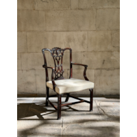A GEORGE II CARVED MAHOGANY ARMCHAIR