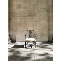 A GEORGE II CARVED MAHOGANY ARMCHAIR