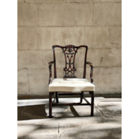 A GEORGE II CARVED MAHOGANY ARMCHAIR