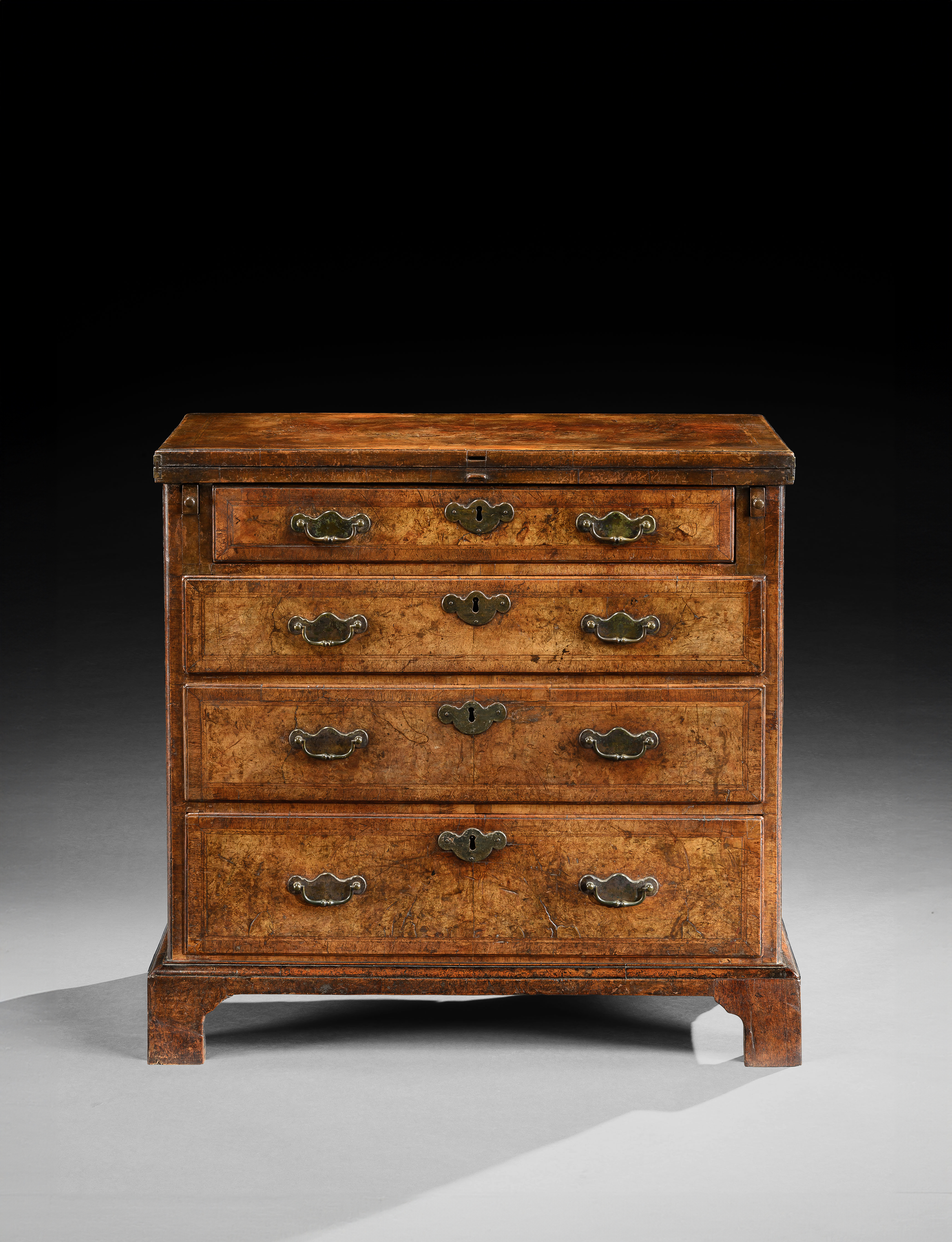 A GEORGE II PERIOD WALNUT BACHELOR’S CHEST