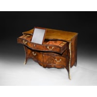A George III period mahogany serpentine commode Attributed to Henry Hill of Marlborough
