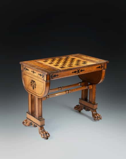 A Regency Period Games Table in Solid and Veneered Lacewood Inlaid with Ebony to a Design by George Smith