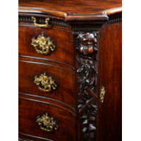 A PAIR OF GEORGE II PERIOD SERPENTINE FRONTED MAHOGANY COMMODES ATTRIBUTED TO THE WORKSHOP OF WILLIAM VILE OR WILLIAM HALLETT THE CARVING POSSIBLY BY JOHN BOSON