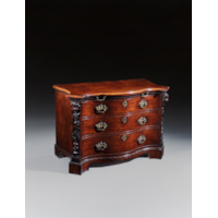 A PAIR OF GEORGE II PERIOD SERPENTINE FRONTED MAHOGANY COMMODES ATTRIBUTED TO THE WORKSHOP OF WILLIAM VILE OR WILLIAM HALLETT THE CARVING POSSIBLY BY JOHN BOSON